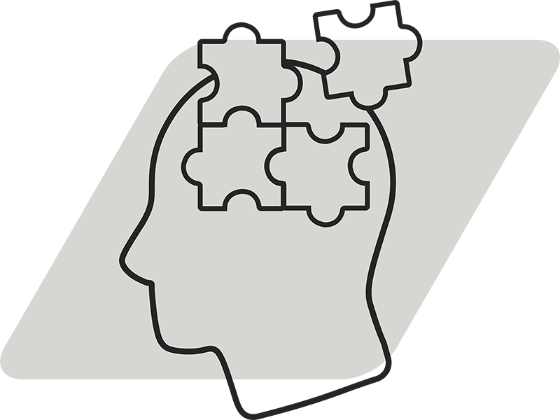 Icon of a human head with puzzle pieces for the brain.