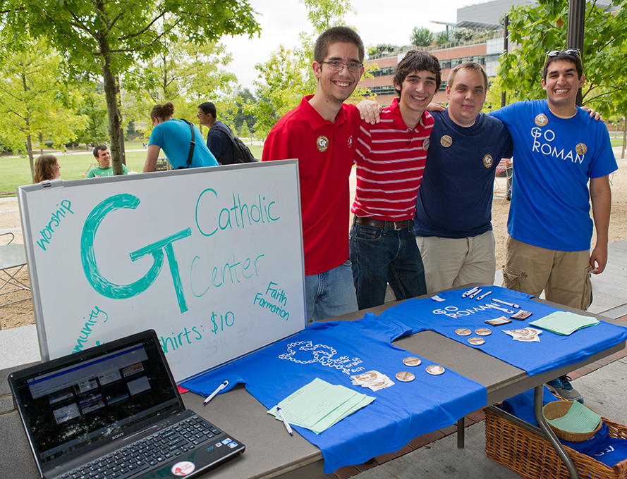 Students from the Catholic Center host an info table on Tech Walk.